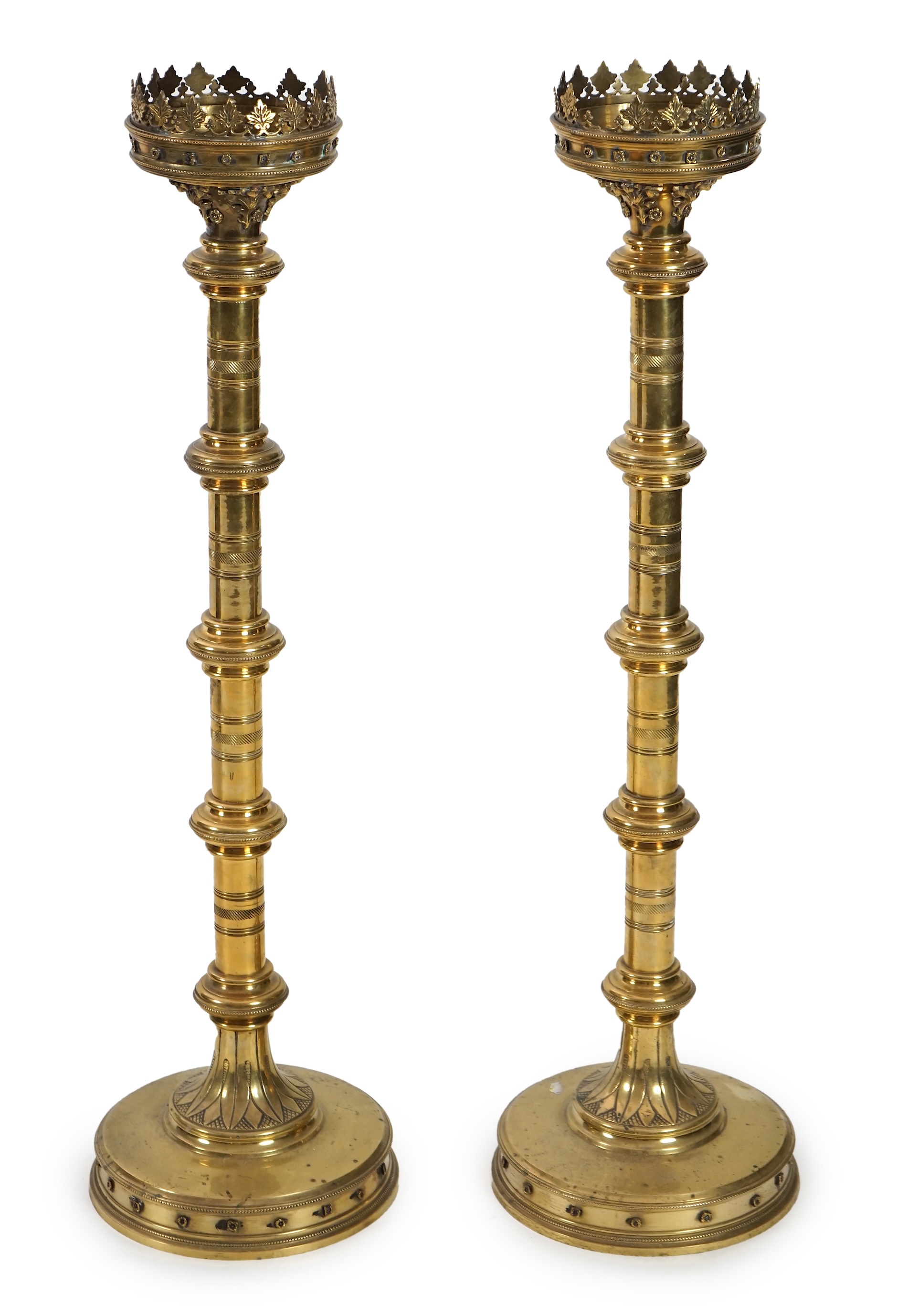 A pair of Victorian Gothic brass altar sticks